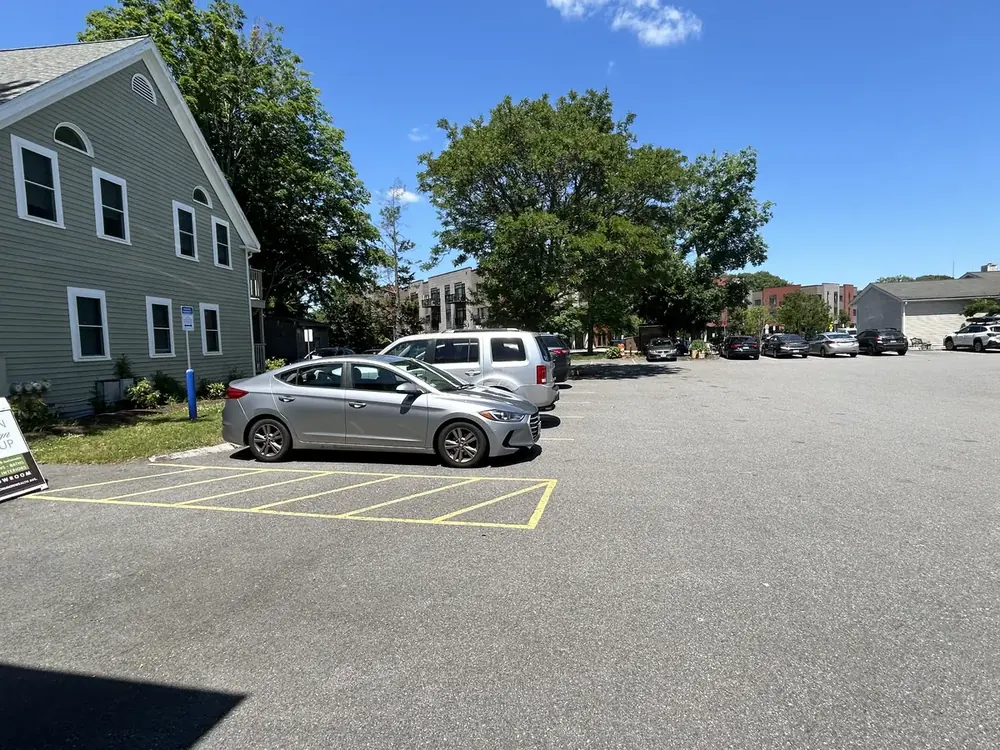 The parking lot behind the building on a sunny day